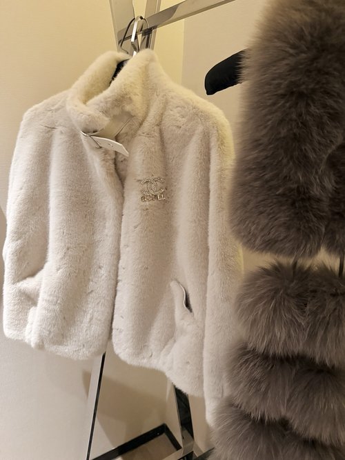 Chanel Faux Fur Coat with Brooch: Luxurious New Year s Ensemble